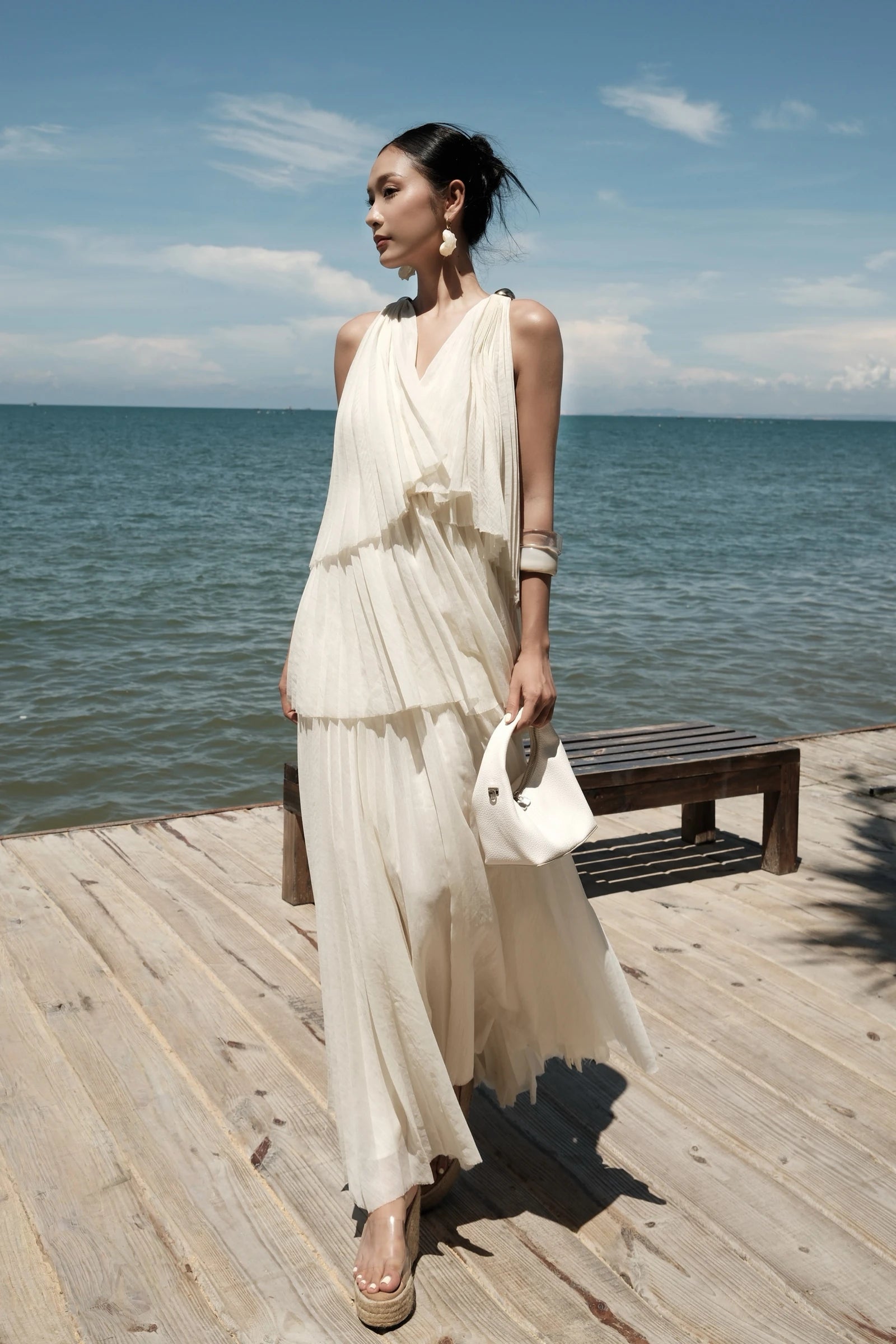 Poeme Tiered Dress in cream - walking on pier