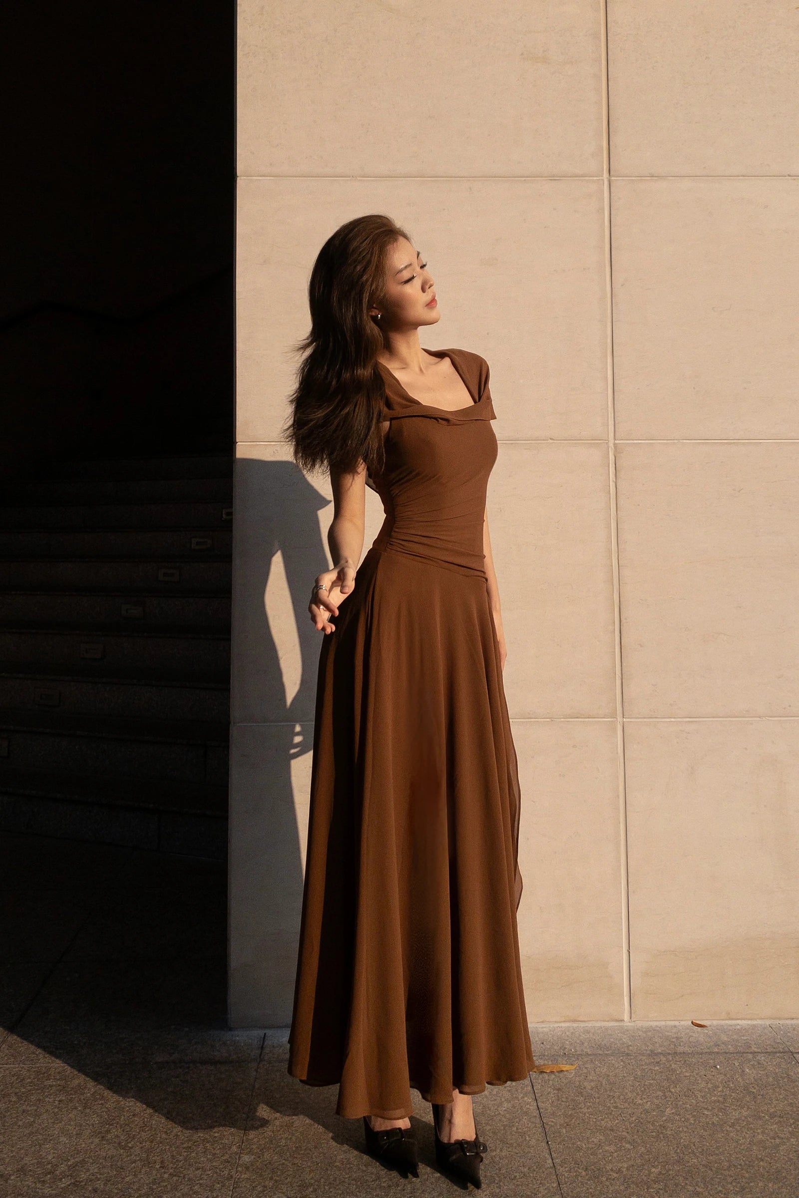 Dune Chiffon Dress in brown - three quarter view