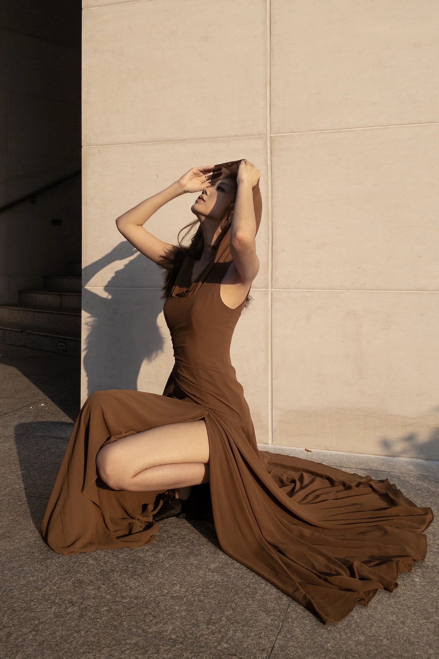 Dune Chiffon Dress in brown - seated pose