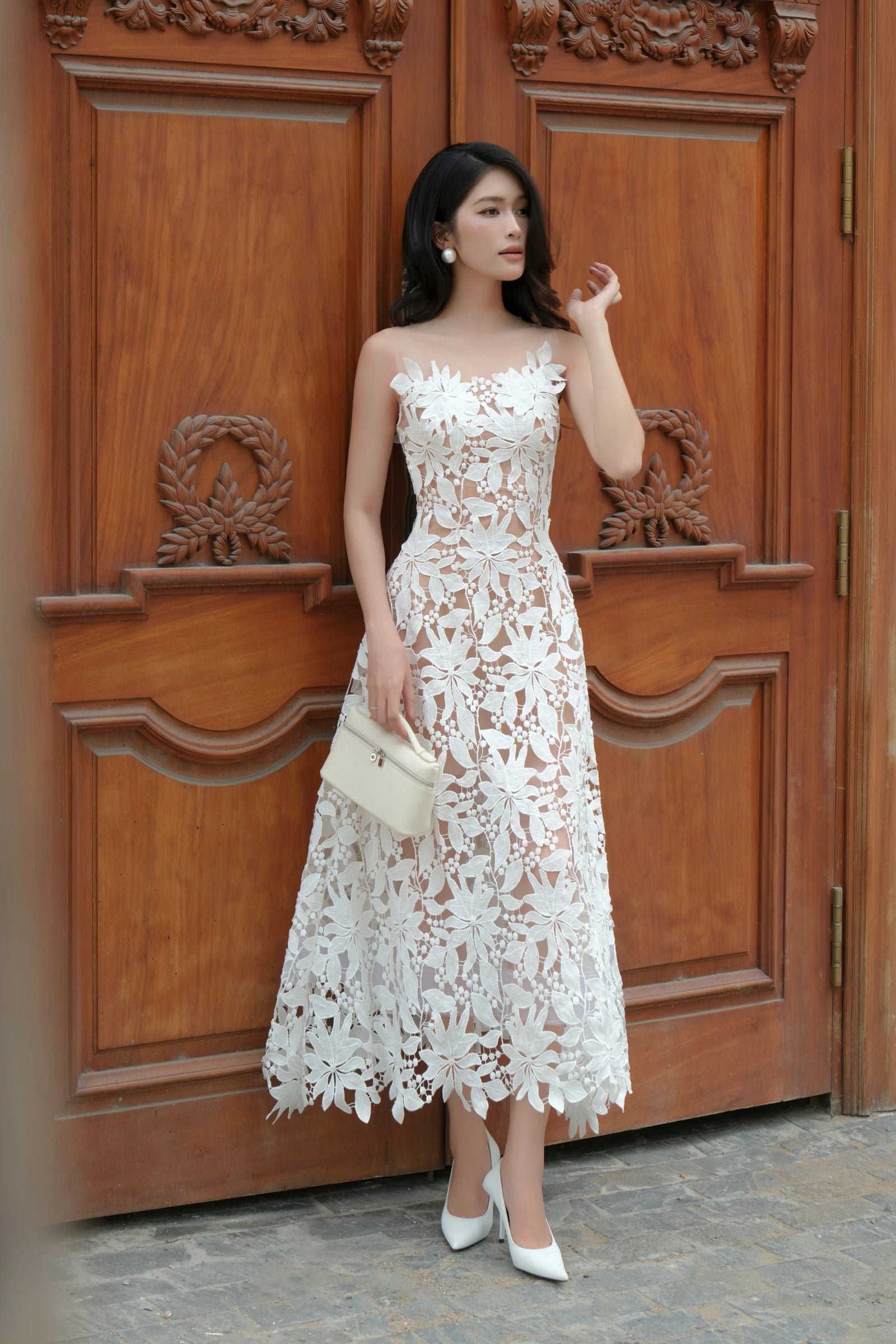 Lily Lace Dress in white - three quarter view with clutch