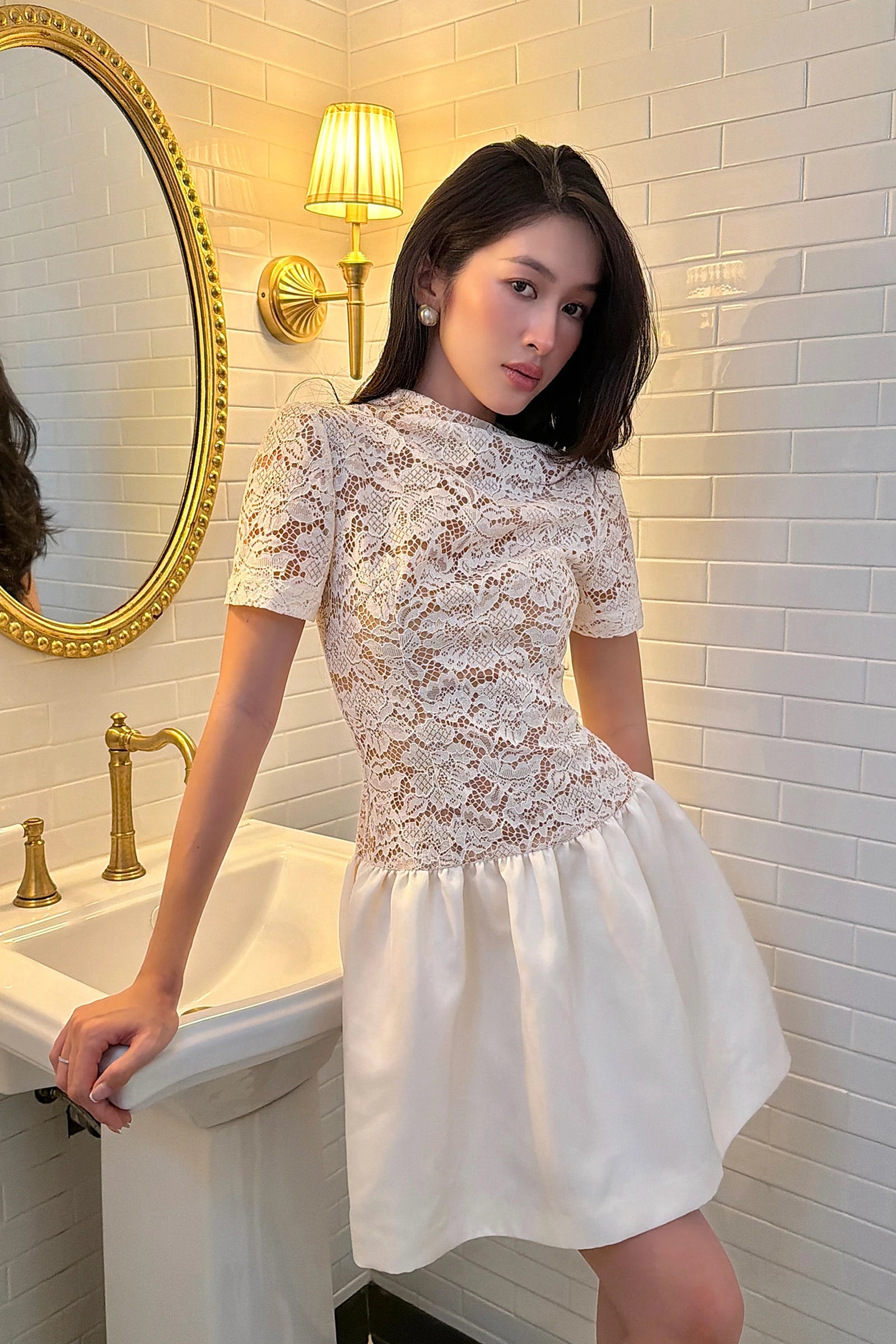 Signature Peplum Dress in ivory - three quarter view